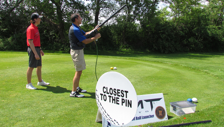 picture of a golfer using a golf ball launcher