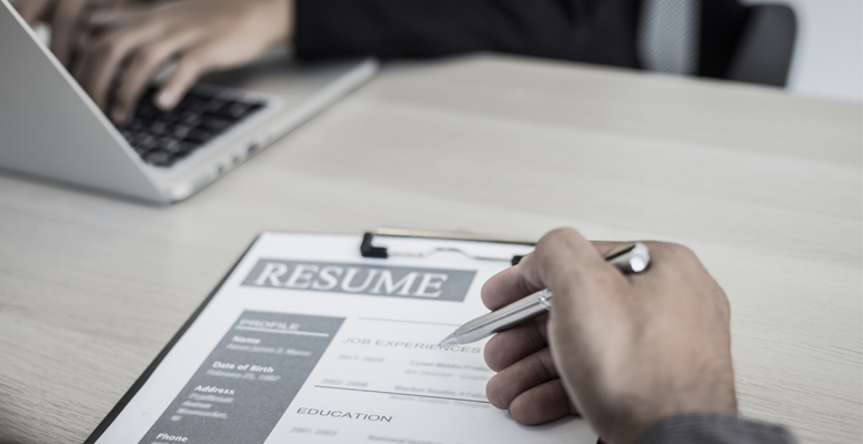 thumbnail picture of a meeting reviewing resume